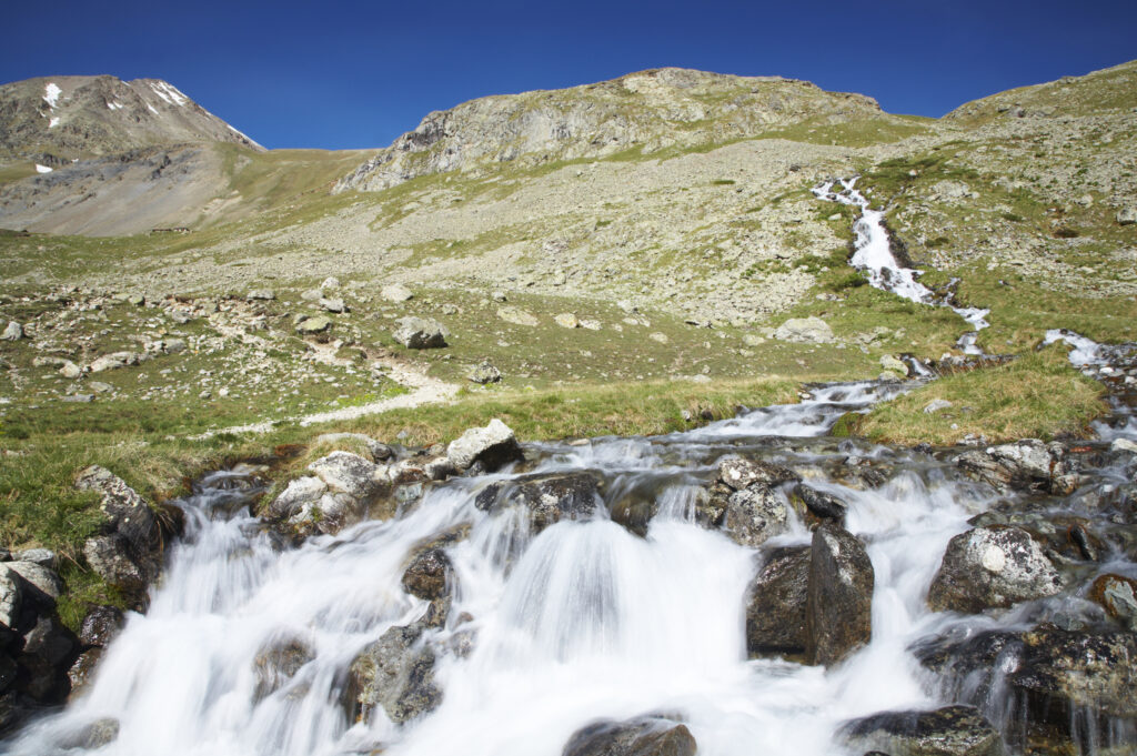 France, Rhône-Alpes, The Ecrins National Park. Mountain stream running near the La Plan de l'Alpe in the Ecrins National Park.