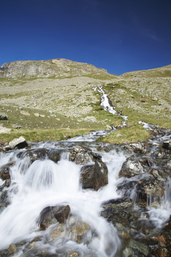 France, Rhône-Alpes, The Ecrins National Park. Mountain stream running near the La Plan de l'Alpe in the Ecrins National Park.