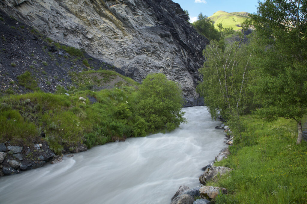 France, Rhône-Alpes, The Ecrins National Park. The la Romanche River flowing through a gorge in the mountains near La Grave.