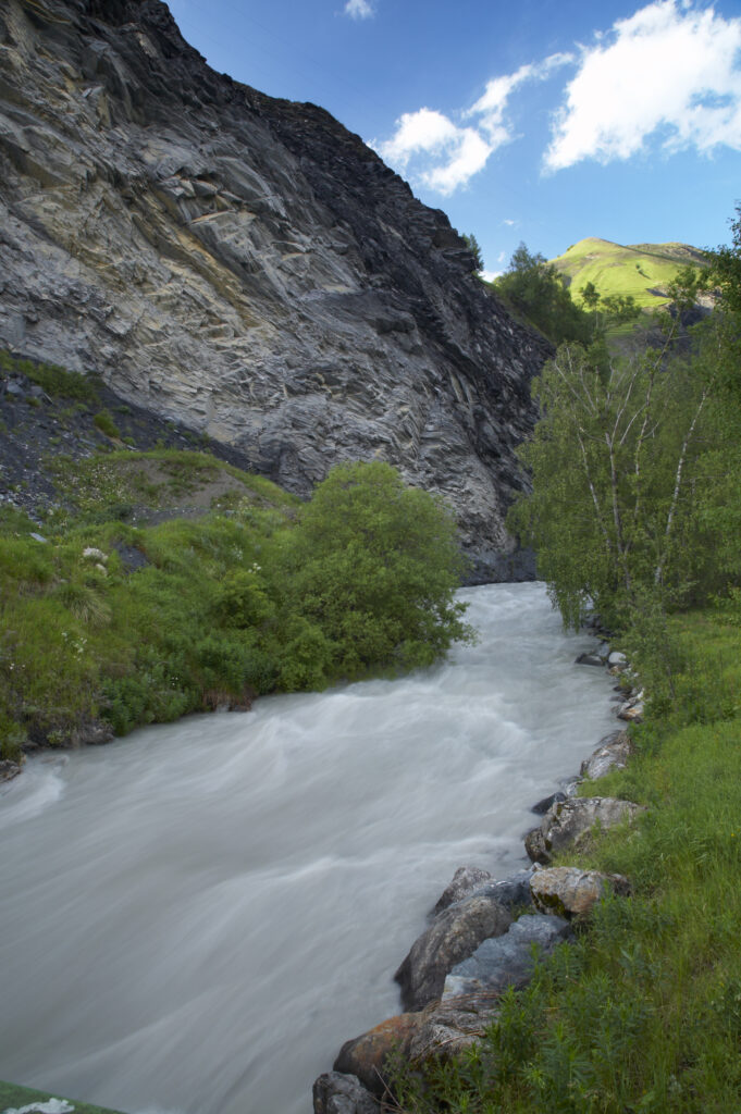 France, Rhône-Alpes, The Ecrins National Park. The la Romanche River flowing through a gorge in the mountains near La Grave.