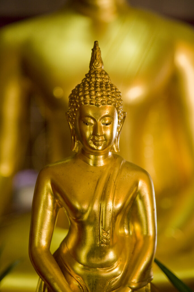 Thailand, Bangkok, Buddha. Gold Buddha statue located at a Wat in Bangkok.