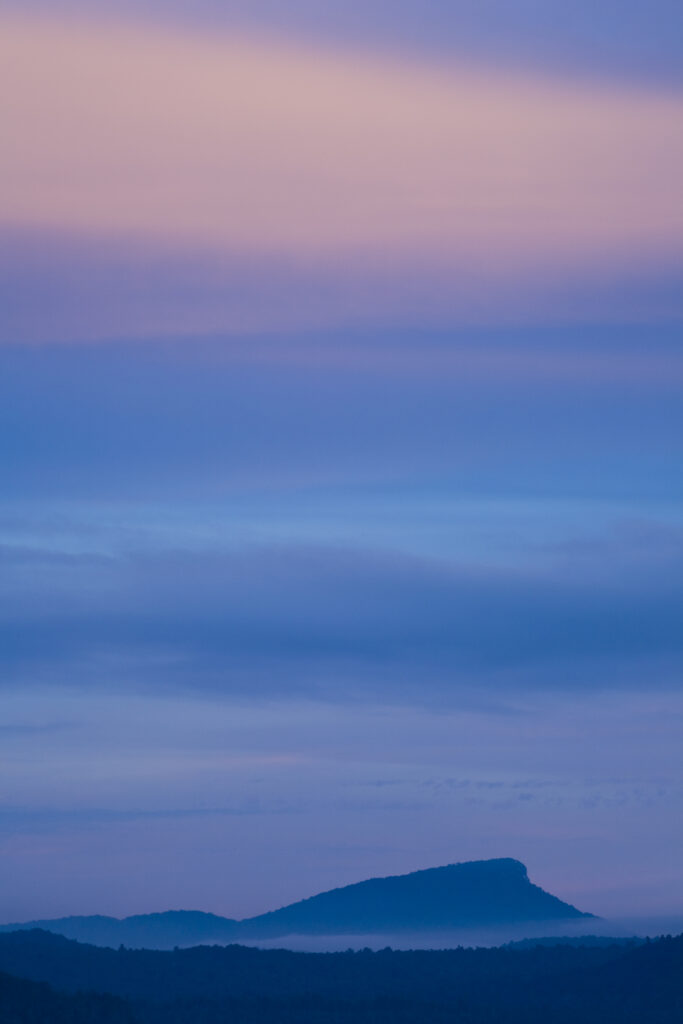 New Zealand, Southland, Fiordland National Park. The Hump Ridge mountain viewed at sunset.
