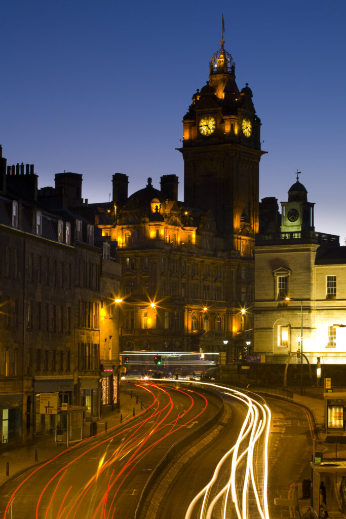 Scotland, Edinburgh, Leith Street. Rush hour traffic on Leith Street looking towards the Balmoral Hotel and the Register House.