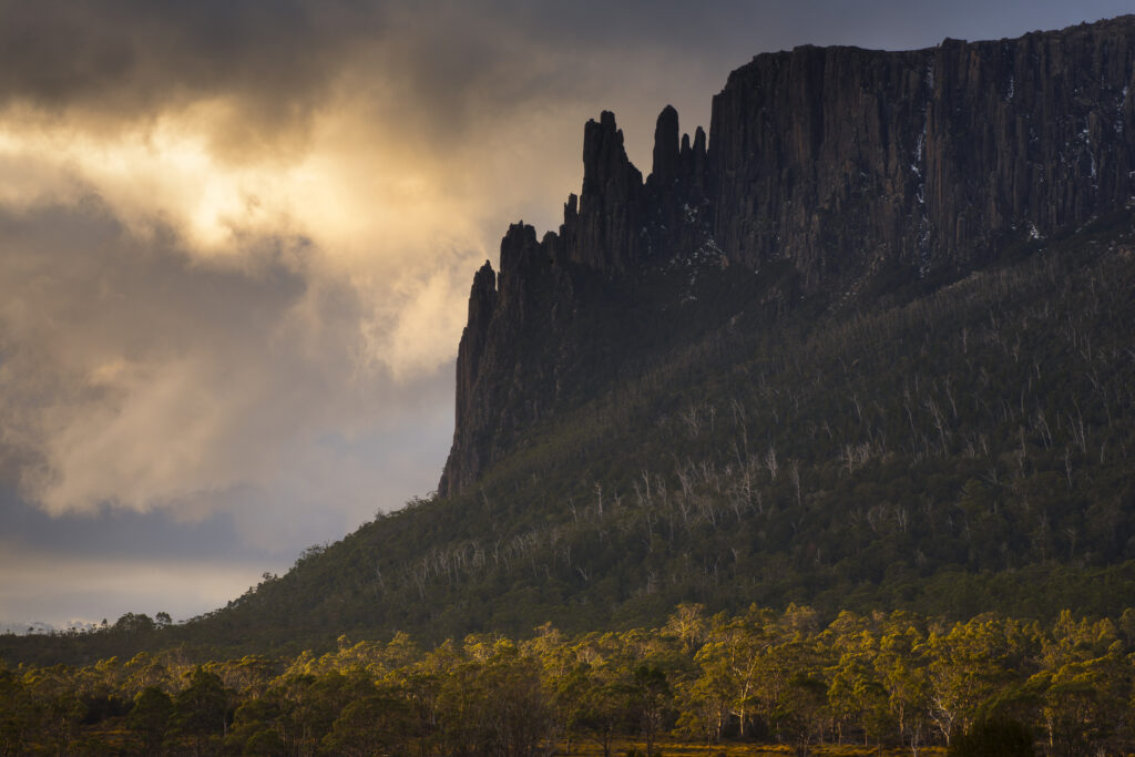 Australia, Tasmania, Cradle Mt - Lake St Clair National Park. Dramatic sky and Mount Oakleigh seen from New Pelion Hut on the Overland Track.