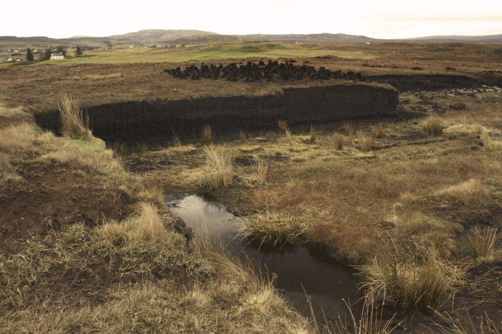 Scotland, Scottish Highlands and Islands, The Isle of Skye. The scarred landscape caused by the cutting of peat.