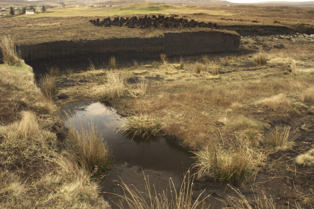 Scotland, Scottish Highlands and Islands, The Isle of Skye. The scarred landscape caused by the cutting of peat.