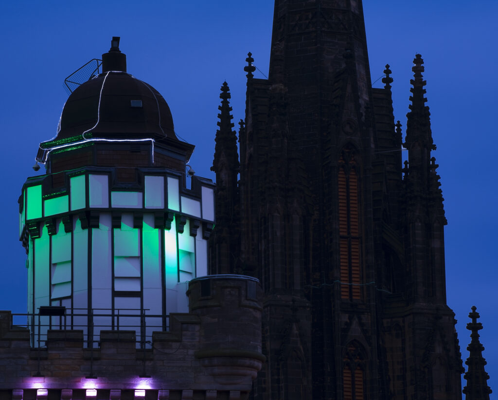 Scotland, Edinburgh, The Royal Mile. The Camera Obscura with The Hub in the background. Originally known as the Assembly Hall, this historic landmark of the Royal Mile is a grade A listed building constructed between 1842 and 1845.