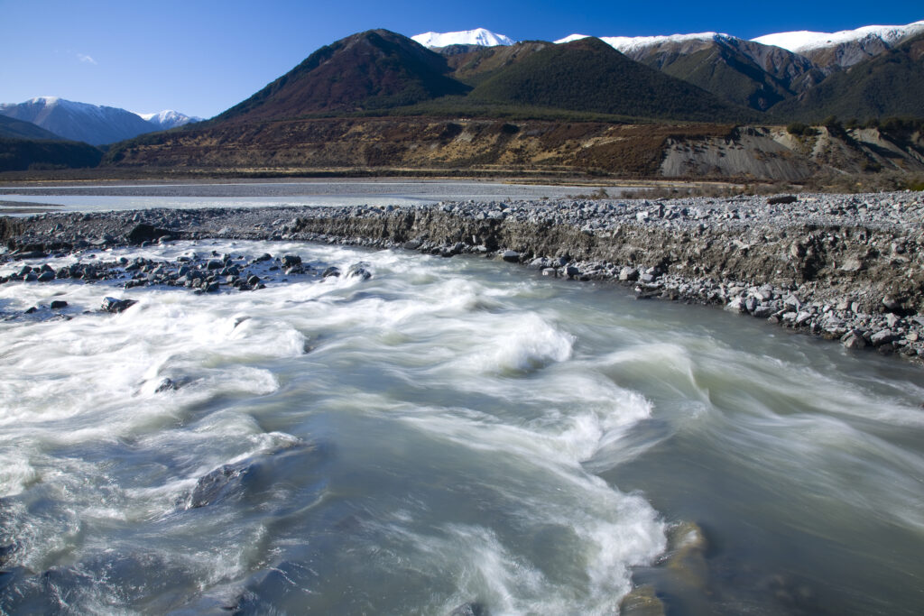 New Zealand, Canterbury, Arthur's Pass National Park. Creek running into the Poulter River and the Poulter Valley.