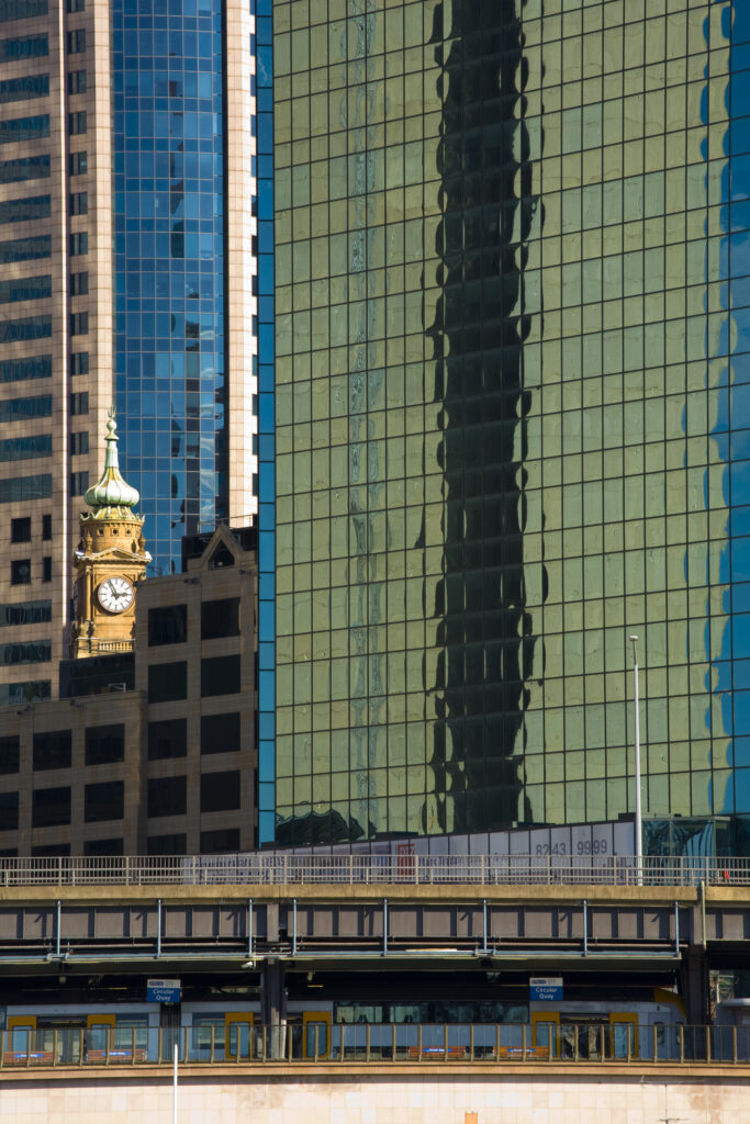 Australia, New South Wales, Sydney. City skyscrapers dominate the skyline near Circular Quay at Sydney Harbour.
