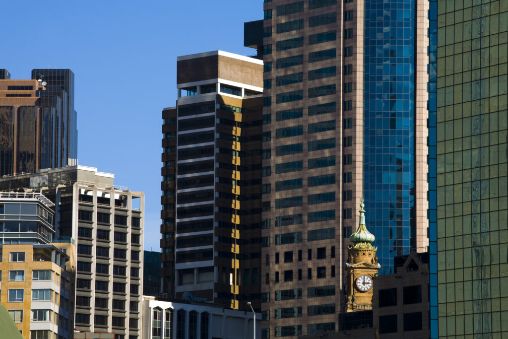 Australia, New South Wales, Sydney. City skyscrapers dominate the skyline near Circular Quay at Sydney Harbour.