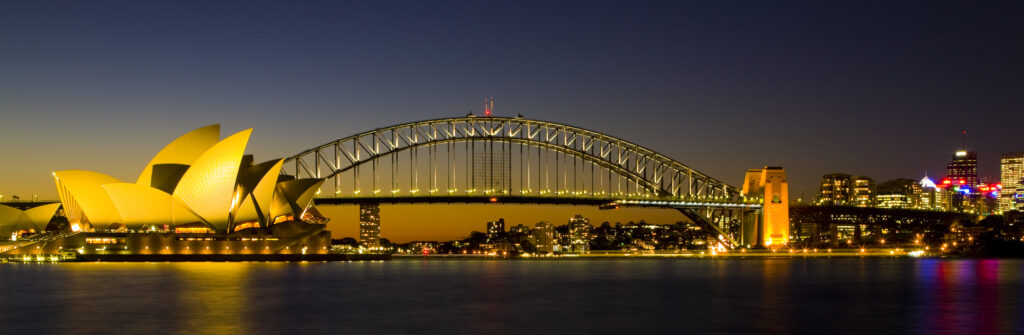 Australia, New South Wales, Sydney. Sydney Harbour bridge and the opera house viewed at dusk.