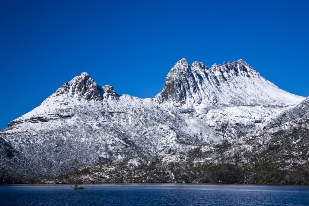 Australia, Tasmania, Cradle Mt - Lake St Clair National Park. Fresh cover of snow on Cradle Mountain, viewed from Dove Lake.