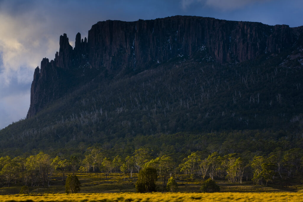 Australia, Tasmania, Cradle Mt - Lake St Clair National Park. Dramatic sky and Mount Oakleigh seen from New Pelion Hut on the Overland Track.