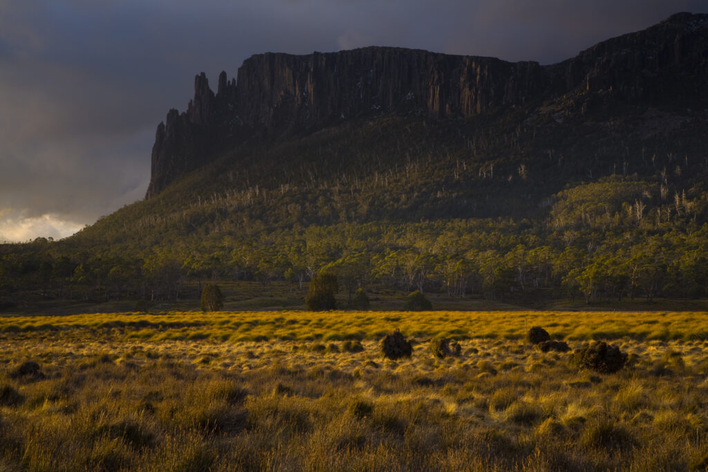 Australia, Tasmania, Cradle Mt - Lake St Clair National Park. Dramatic sky and Mount Oakleigh seen from New Pelion Hut on the Overland Track.