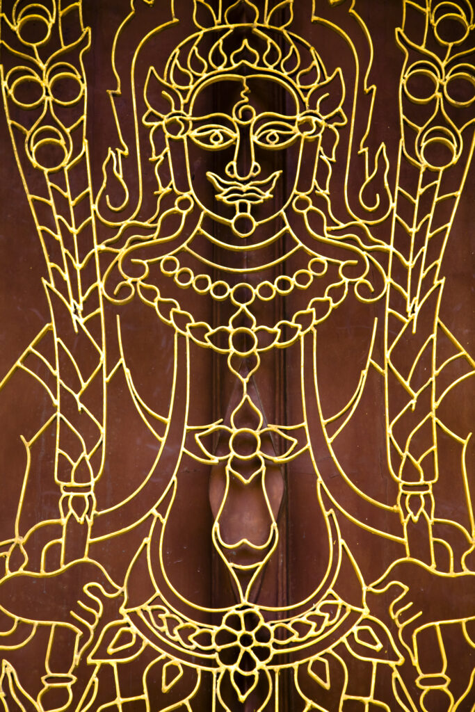 Thailand, Bangkok, Wat Chana Songkram. Details of a Buddha on a window grill at Wat Chana Songkram.