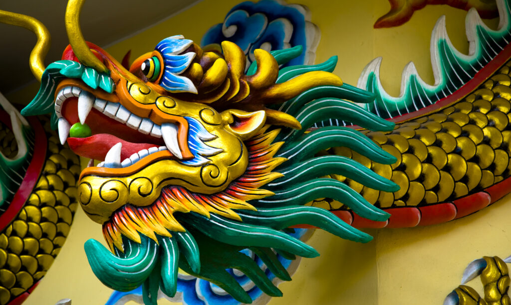 Thailand, Bangkok, Wat Chana Songkram. Colourful detail situated on the wall of a building forming part of the Wat Chana Songkram complex.