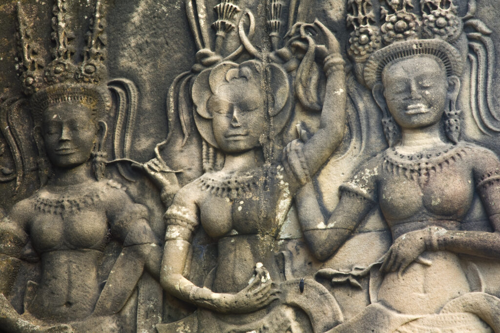 Cambodia, Angkor, Angkor Wat. Close up details of Angkor relief art on the walls of the dramatic remains of Angkor Wat.