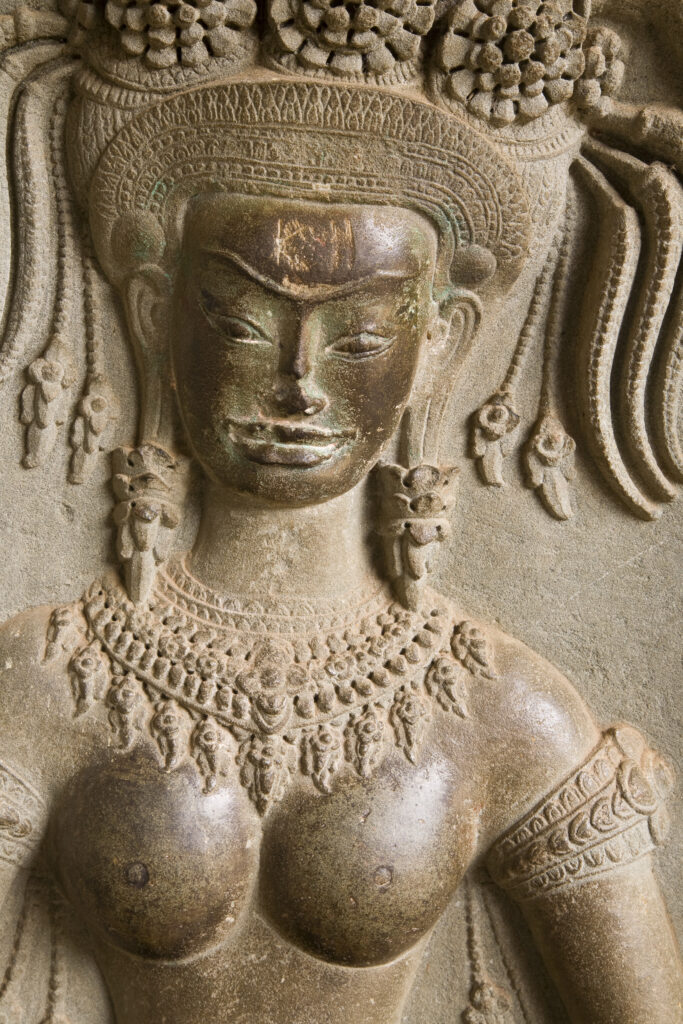 Cambodia, Angkor, Angkor Wat. Close up details of Angkor relief art on the walls of the dramatic remains of Angkor Wat.