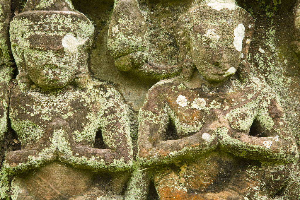 Cambodia, Angkor, Angkor Wat. Close up details of Angkor relief art on the walls of the dramatic remains of Angkor Wat.