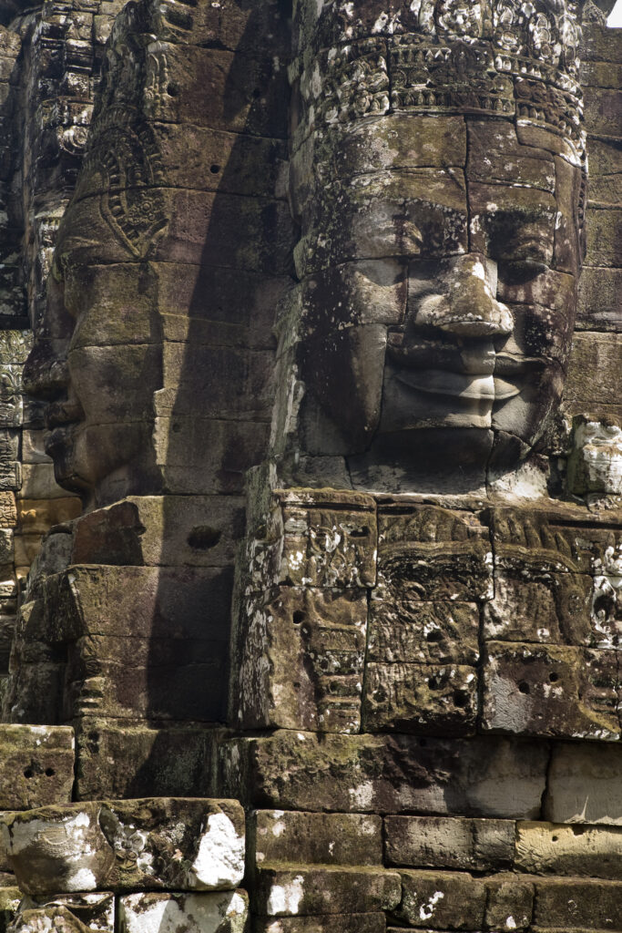 Cambodia, Angkor Thom, Bayon. Massive stone faces watch your every move at Bayon, a well-known and richly decorated Khmer temple at Angkor in Cambodia.