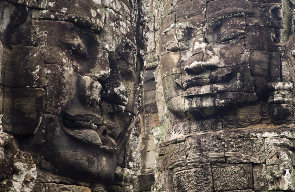 Cambodia, Angkor Thom, Bayon. Massive stone faces watch your every move at Bayon, a well-known and richly decorated Khmer temple at Angkor in Cambodia.