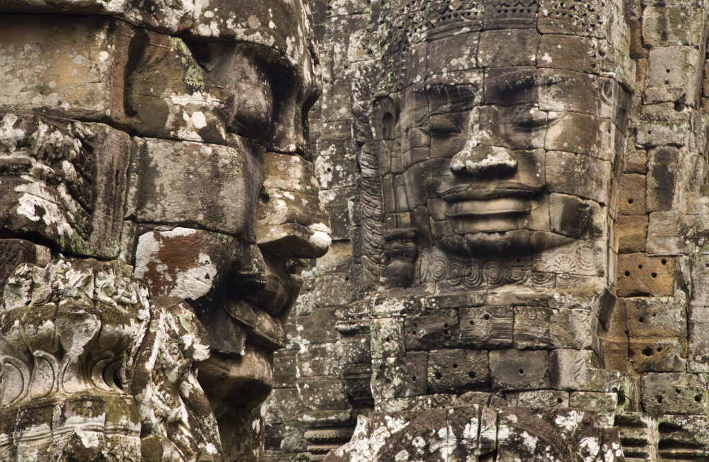 Cambodia, Angkor Thom, Bayon. Massive stone faces watch your every move at Bayon, a well-known and richly decorated Khmer temple at Angkor in Cambodia.