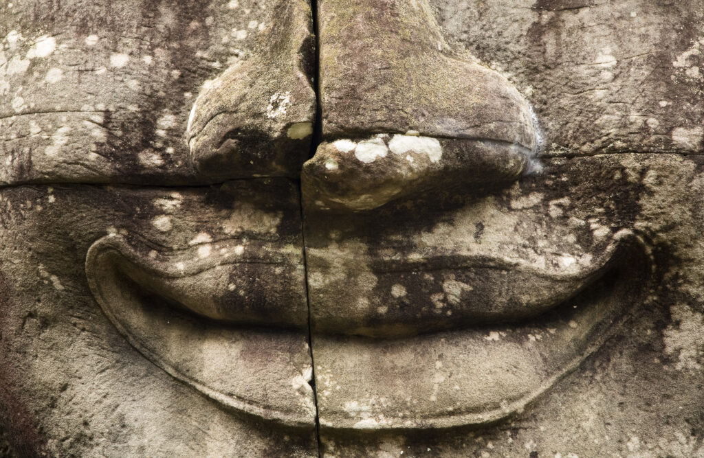 Cambodia, Angkor Thom, Bayon. Massive stone faces watch your every move at Bayon, a well-known and richly decorated Khmer temple at Angkor in Cambodia.