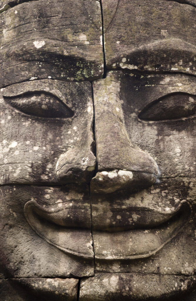 Cambodia, Angkor Thom, Bayon. Massive stone faces watch your every move at Bayon, a well-known and richly decorated Khmer temple at Angkor in Cambodia.