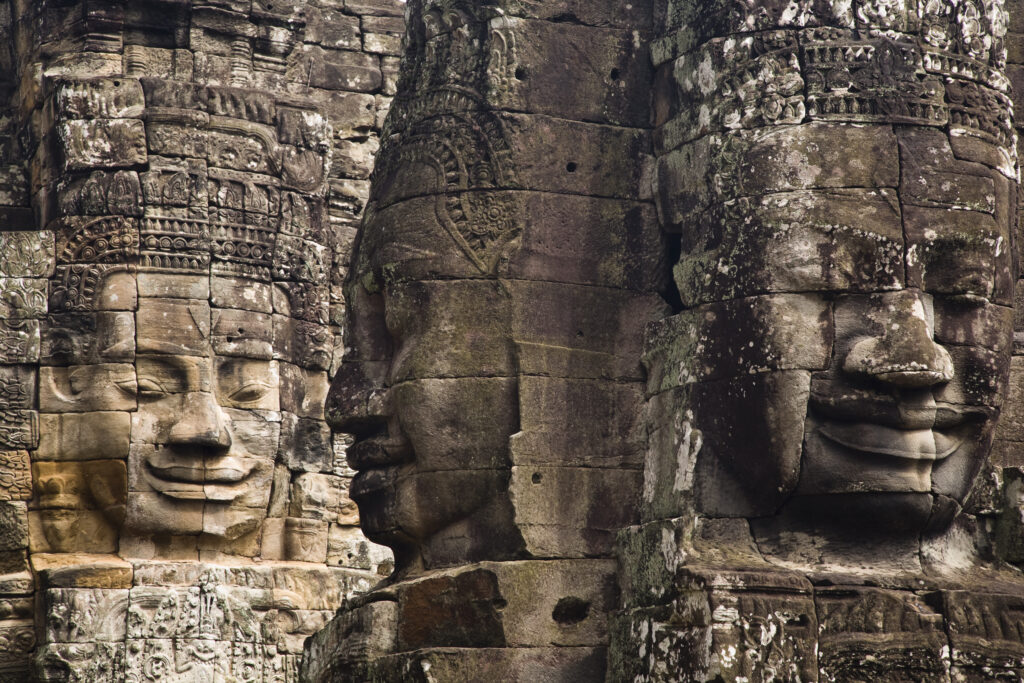 Cambodia, Angkor Thom, Bayon. Massive stone faces watch your every move at Bayon, a well-known and richly decorated Khmer temple at Angkor in Cambodia.