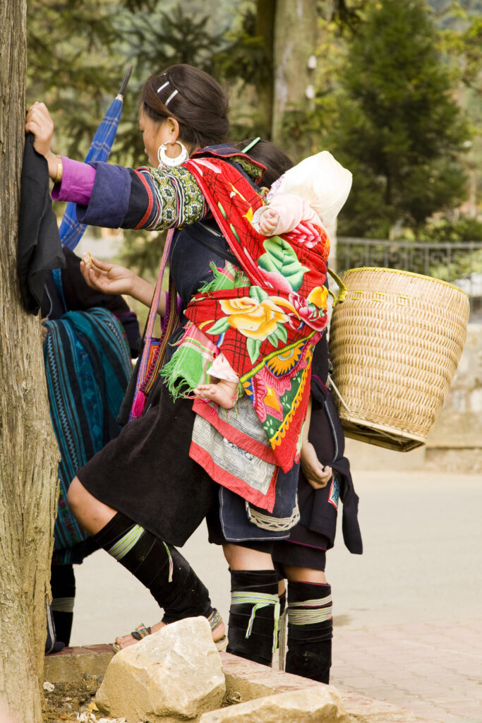 Vietnam, Northern Vietnam, Sapa. Baby carried on a back of a woman from a hill tribe near to Sapa.