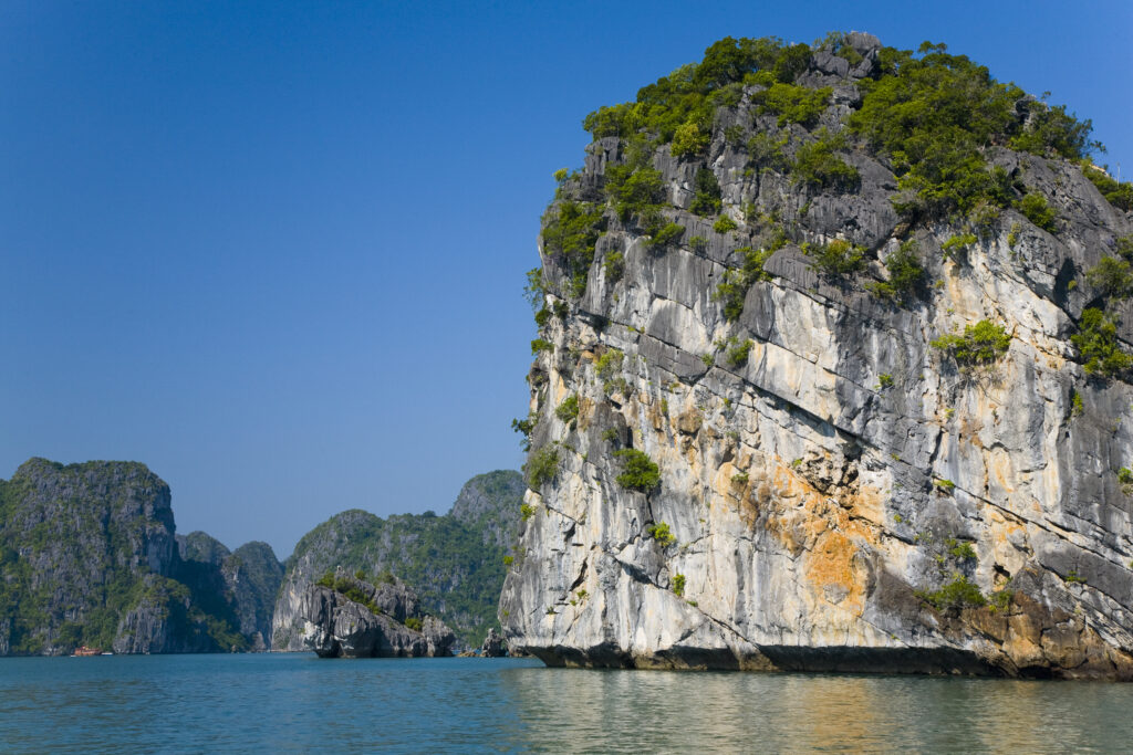 Vietnam, Northern Vietnam, Halong Bay. Vegetation covered islands in Halong Bay near Cat Ba Island.
