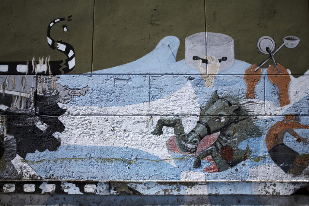 Argentina, Buenos Aires Province, Buenos Aires. Mural / art painted on a wall in the San Telmo area.