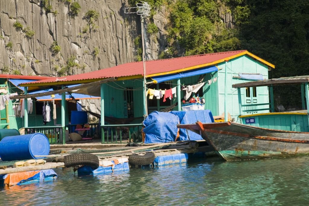 Vietnam, Northern Vietnam, Halong Bay. Water village amid the islands of Halong Bay near Cat Ba Island.