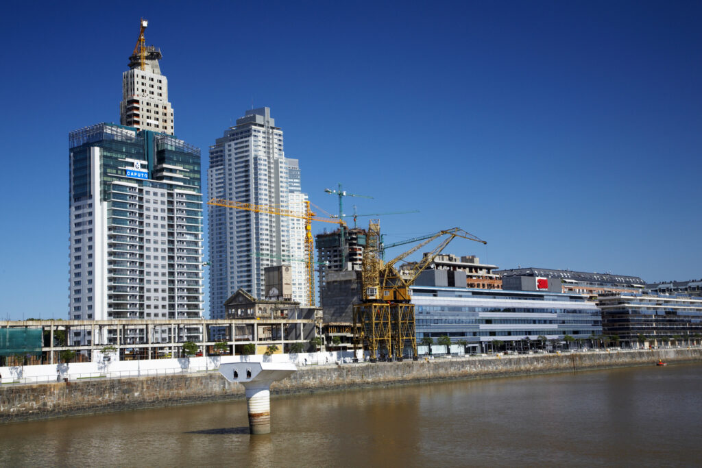Argentina, Buenos Aires Province, Buenos Aires. New development of buidings and construction site on the restored dock side of Puerto Madero.