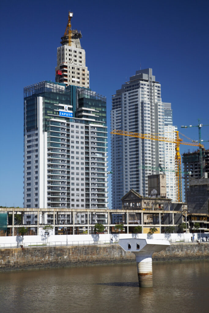 Argentina, Buenos Aires Province, Buenos Aires. New development of buidings and construction site on the restored dock side of Puerto Madero.