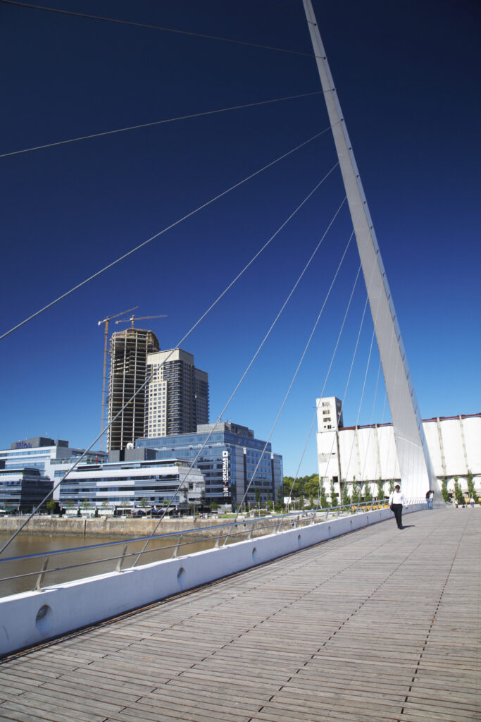 Argentina, Buenos Aires Province, Buenos Aires. Modern bridge on the restored dock side of Puerto Madero.