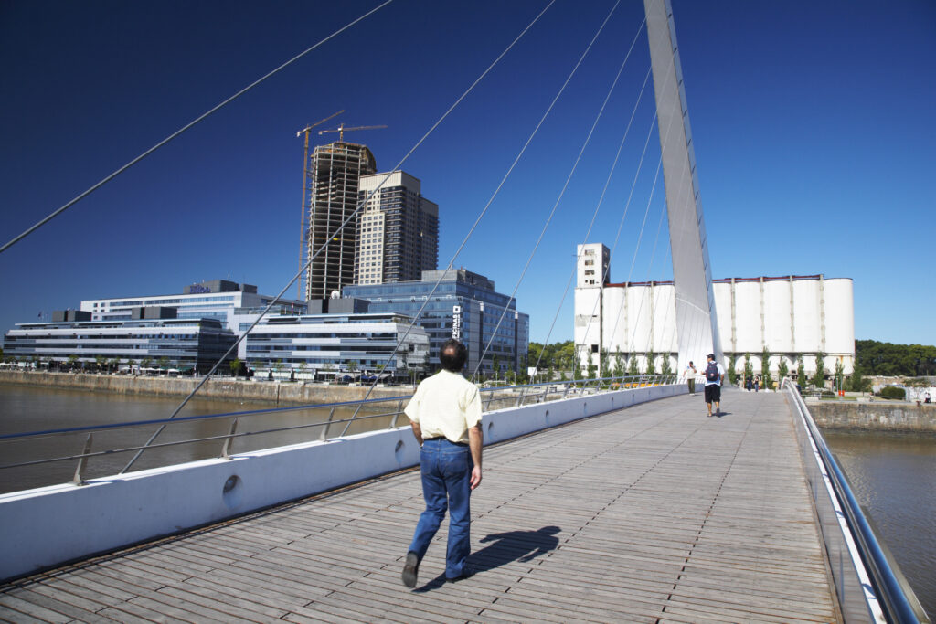 Argentina, Buenos Aires Province, Buenos Aires. Modern bridge on the restored dock side of Puerto Madero.