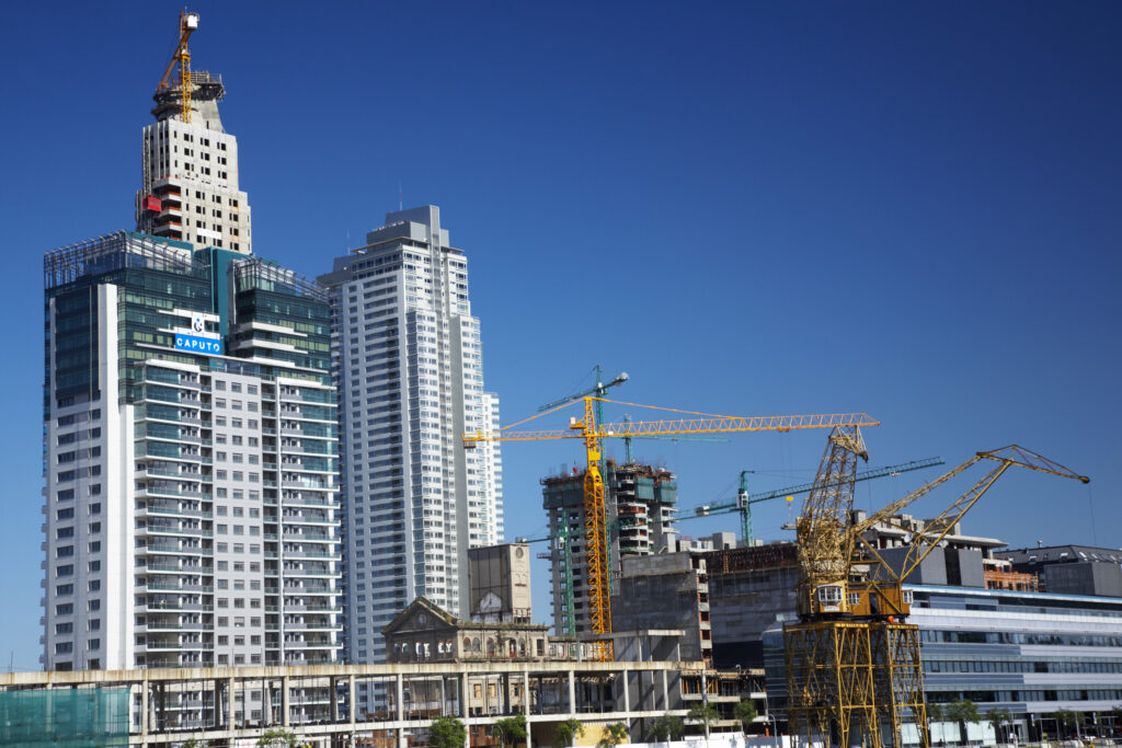 Argentina, Buenos Aires Province, Buenos Aires. New development of buidings and construction site on the restored dock side of Puerto Madero.