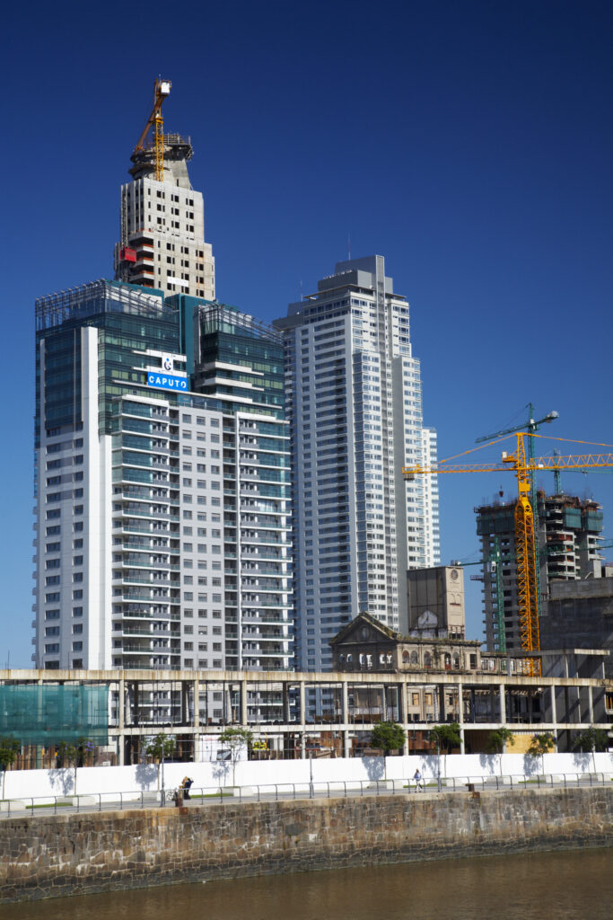 Argentina, Buenos Aires Province, Buenos Aires. New development of buidings and construction site on the restored dock side of Puerto Madero.
