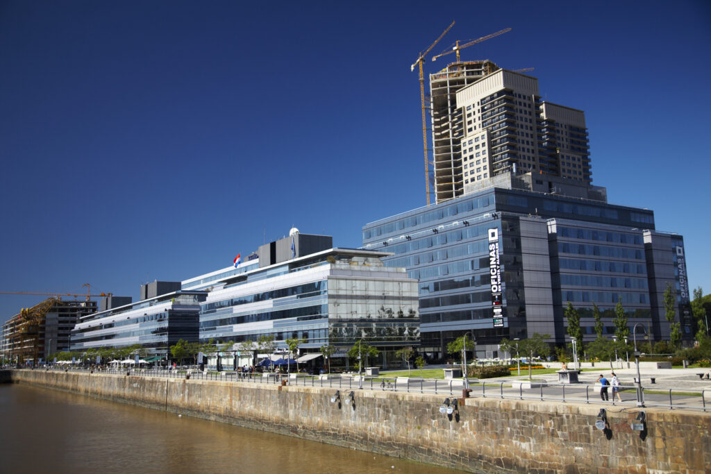 Argentina, Buenos Aires Province, Buenos Aires. New development of buidings and construction site on the restored dock side of Puerto Madero.