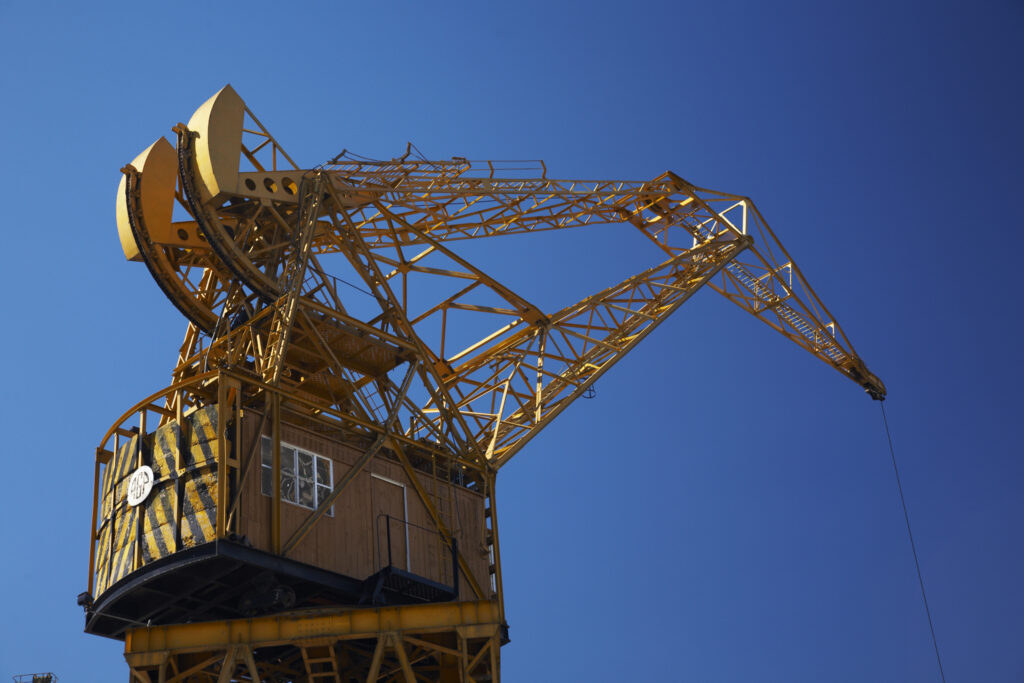 Argentina, Buenos Aires Province, Buenos Aires. Restored crane, situated on the dock side of Puerto Madero.