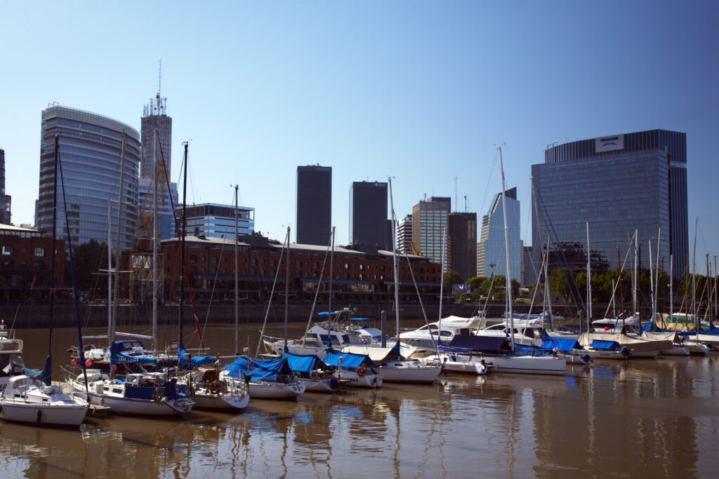 Argentina, Buenos Aires Province, Buenos Aires. Saliing ships and yachts moored on the restored docks of the regenertated Puerto Madero.