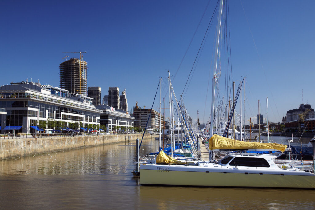 Argentina, Buenos Aires Province, Buenos Aires. Saliing ships and yachts moored on the restored docks of the regenertated Puerto Madero.