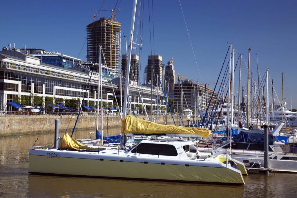 Argentina, Buenos Aires Province, Buenos Aires. Saliing ships and yachts moored on the restored docks of the regenertated Puerto Madero.