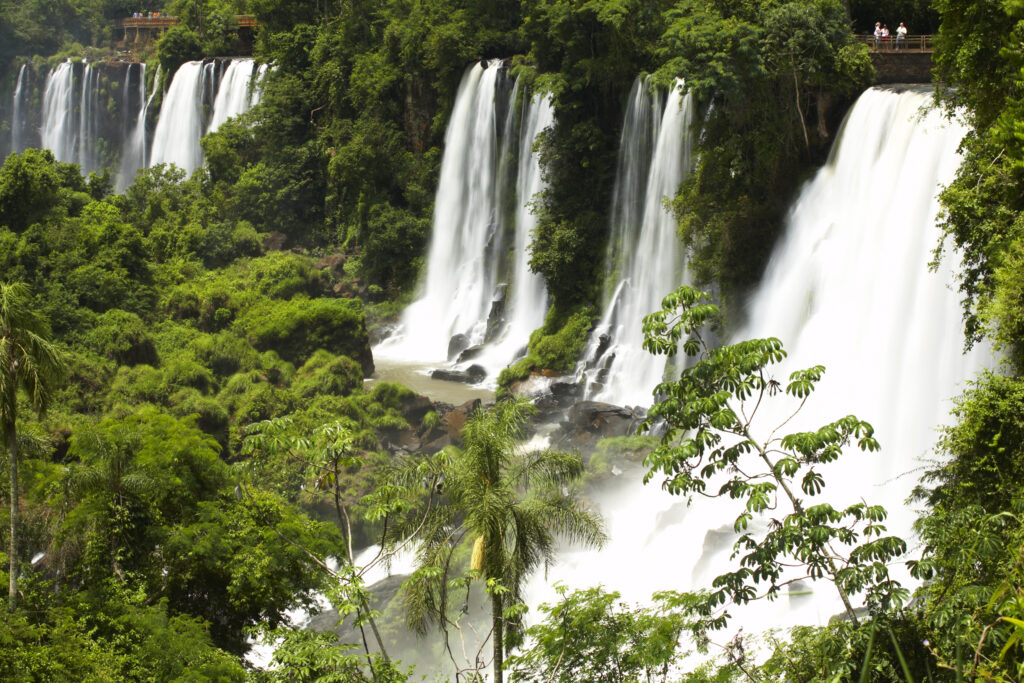 Argentina, Misiones, Iguazu National Park. Tourists watch the impressive Iguazu waterfalls - A world heritage site.