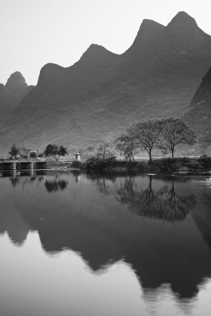 China, Guangxi Zhuang Autonomous Region, Yangshuo County. The Li River and karst peaks near the town of Yangshuo.