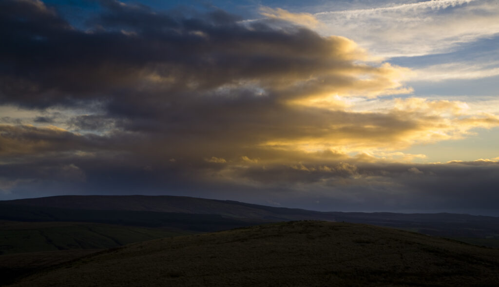 Scotland, Scottish Borders, Liddesdale. Sunset over the hills of Liddesdale near the English border.