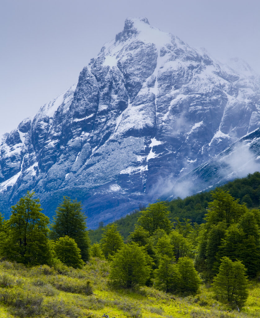 chile, Southern Patagonia, Torres Del Paine National Park. Storm clouds retreat to reveal the dramatic mountain peaks of the Torres Del Paine National Park viewed from the 'Circuit' track.