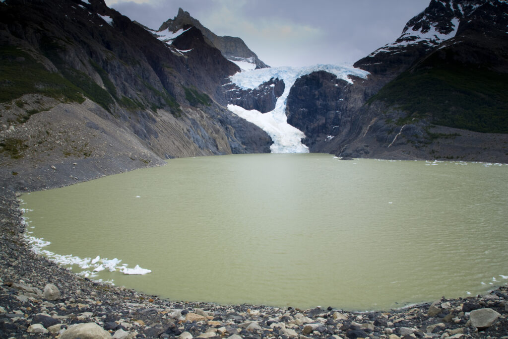 RF - Chile, Southern Patagonia, Torres Del Paine National Park. The perros glaciar running down into a lake passed on the circuit track.