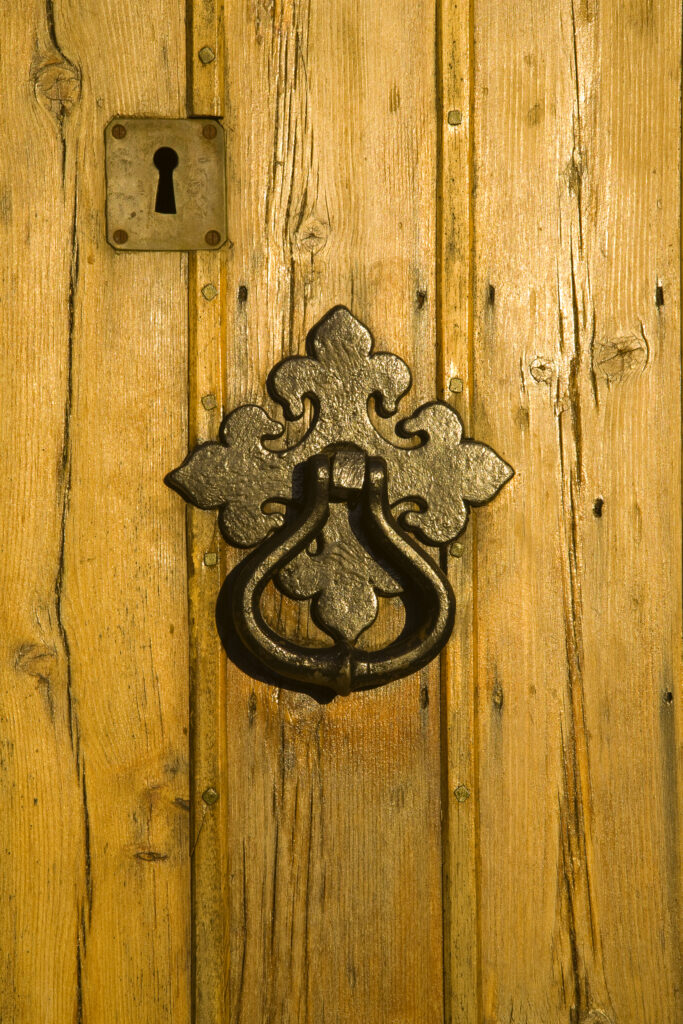 Scotland, Scottish Borders, Coldingham. Details of a grand wooden door at Coldingham Priory.